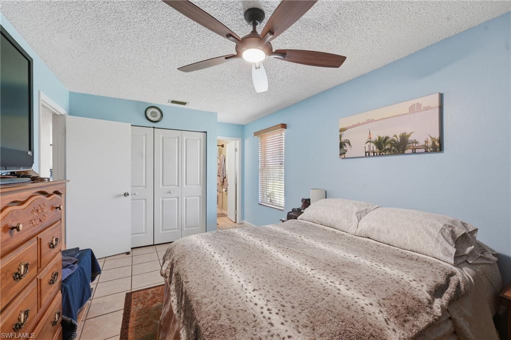 Interior room featuring light blue walls and a textured white ceiling