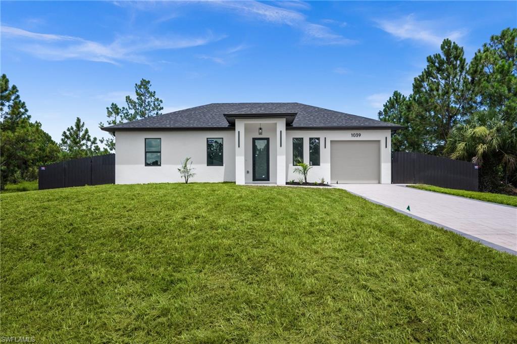 Contemporary single-story residence with a dark shingle roof and a two-tone exterior finish