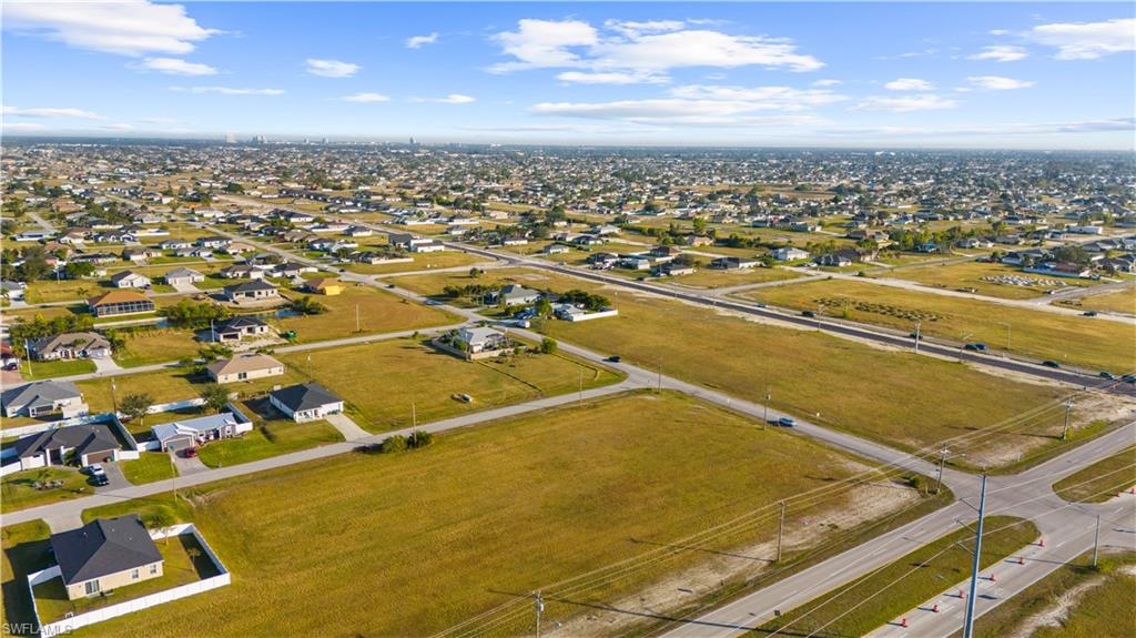 Expansive undeveloped land parcel featuring clear ground and visible road frontage