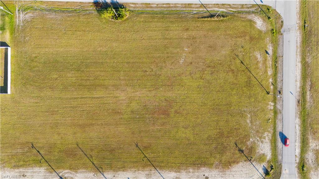 Expansive rectangular lot featuring natural grass and clear boundaries