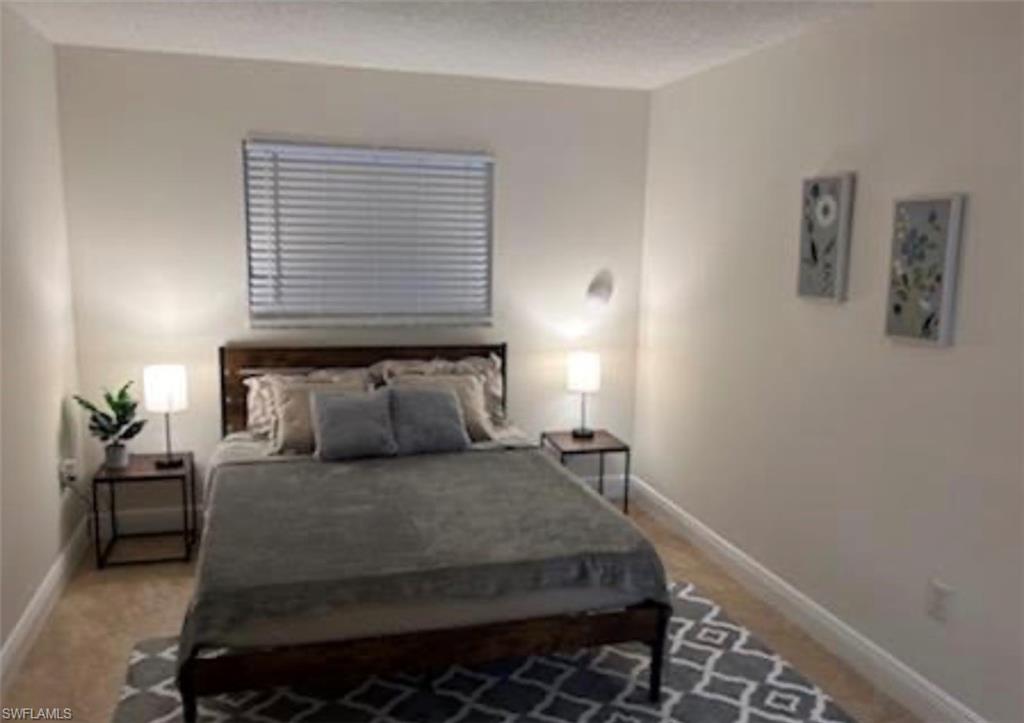 Bedroom featuring baseboards