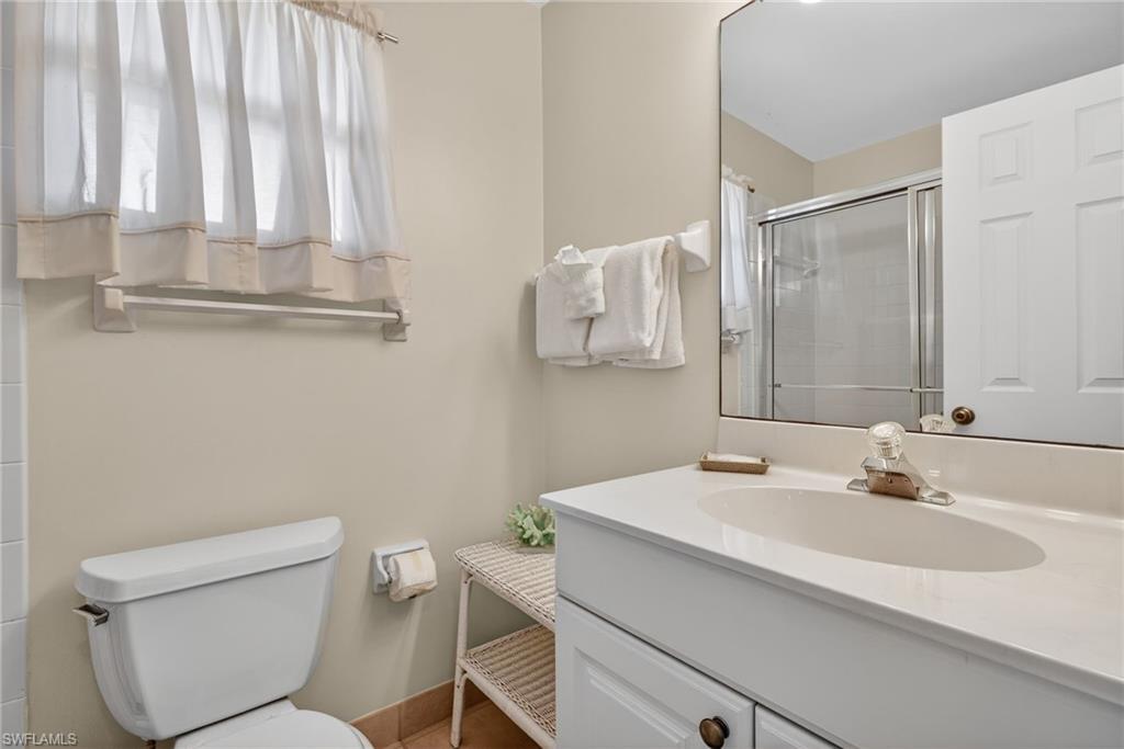 Primary bathroom featuring vanity and a shower stall