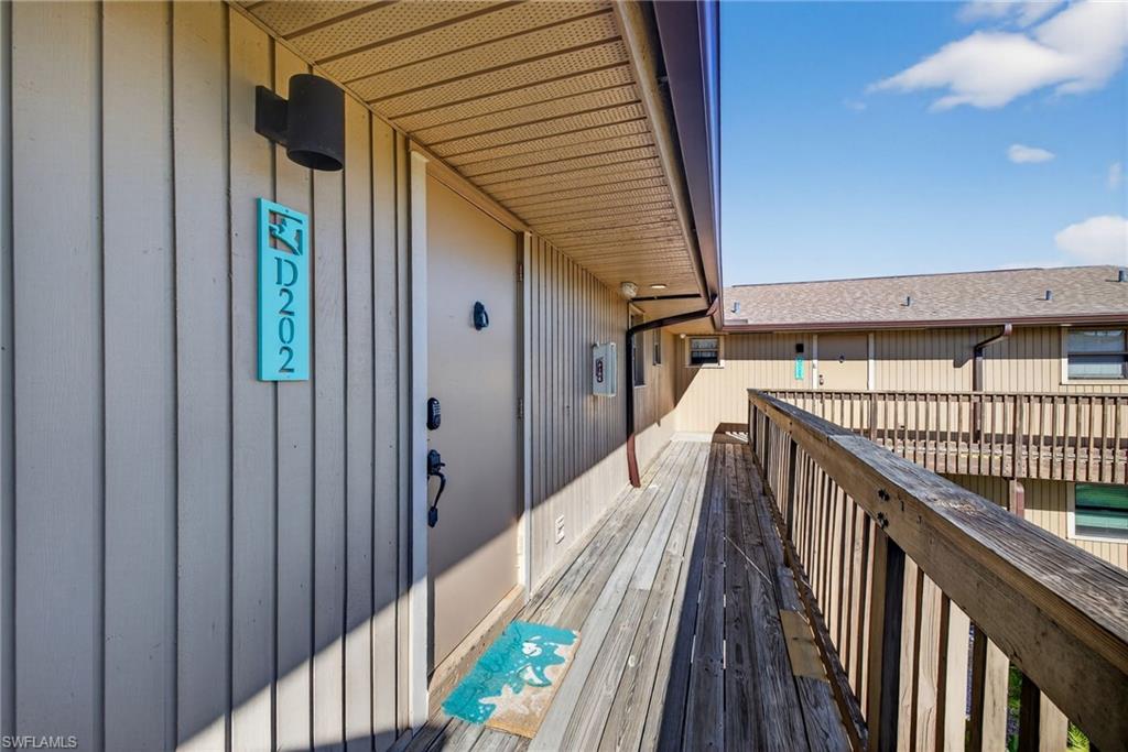 View of wooden balcony featuring a deck