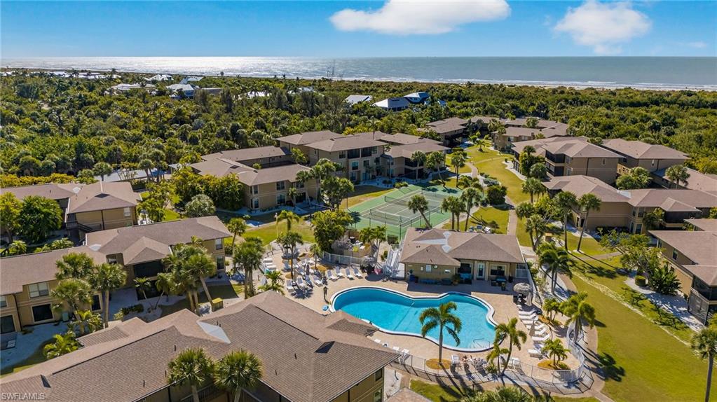 Aerial perspective of suburban area featuring a pool area