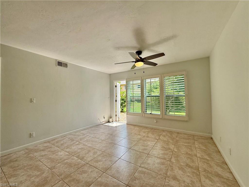 Living area with access to pavered patio