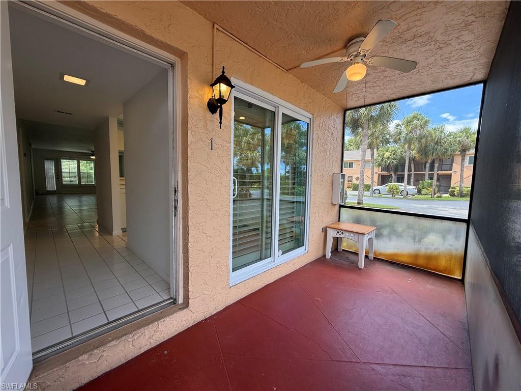 Screened porch with sliders to kitchen.