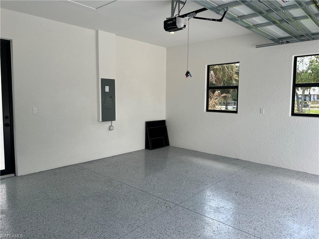 Epoxy garage floor with a tankless water heater