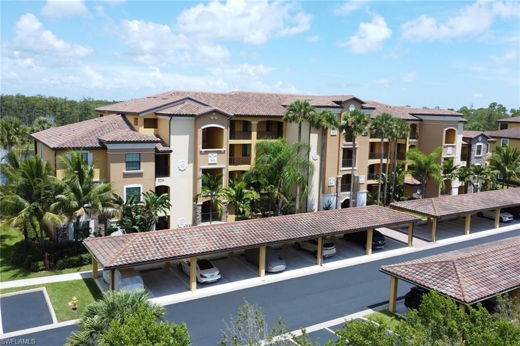Multi-story residential building featuring Mediterranean Revival architecture