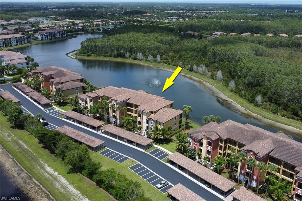 Waterfront multi-story buildings featuring Mediterranean-style architecture, tile roofs, and multiple balconies