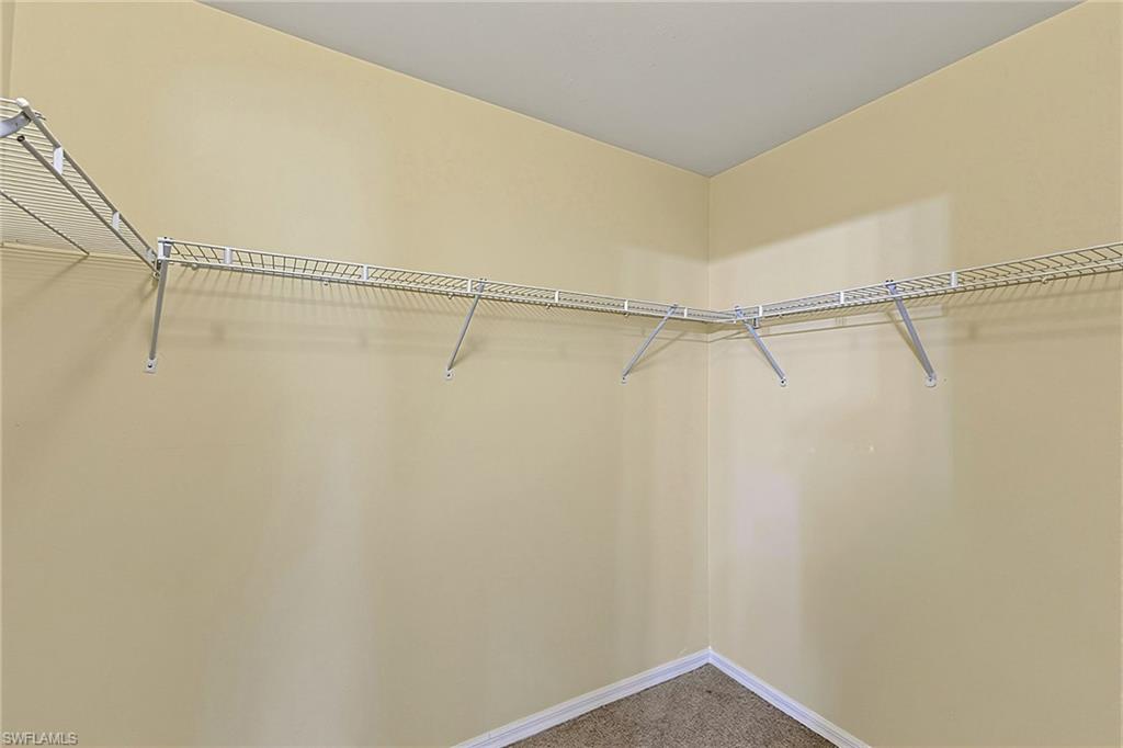 Corner closet featuring wire shelving