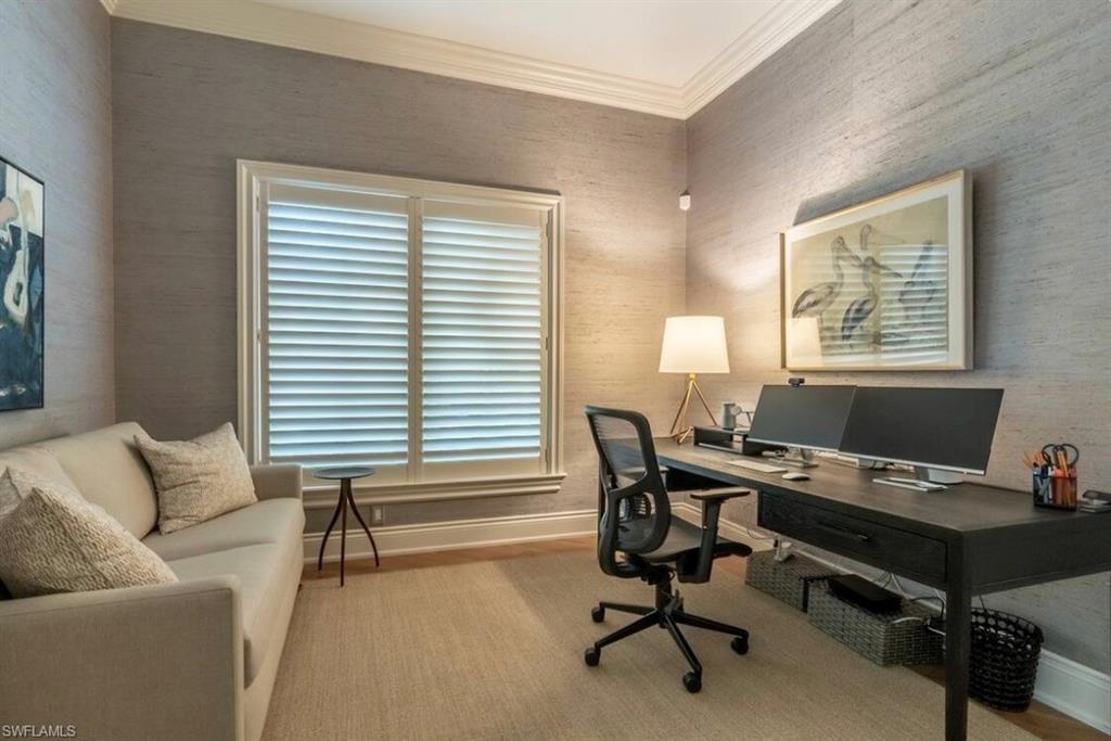 Office featuring crown molding and wallpapered walls
