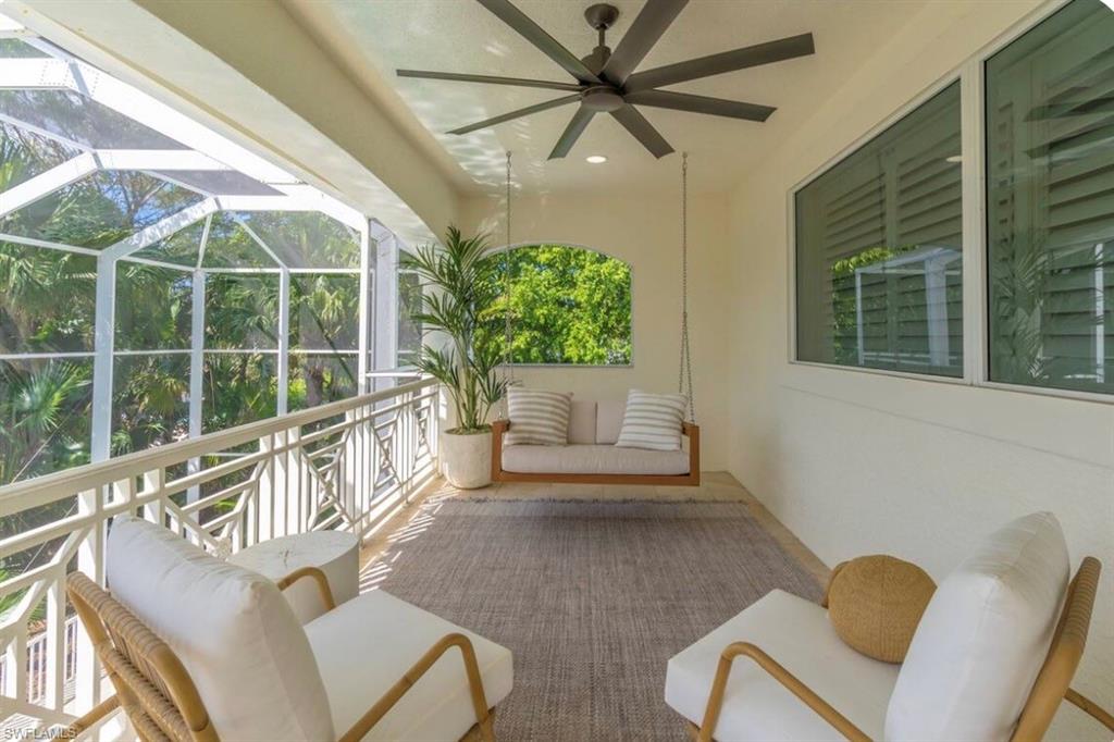 Sunroom featuring ceiling fan and an outdoor hangout area