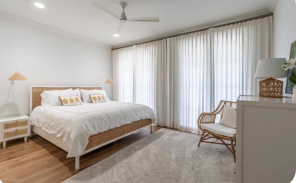 Bedroom with ornamental molding, light wood-style flooring, a ceiling fan, and recessed lighting