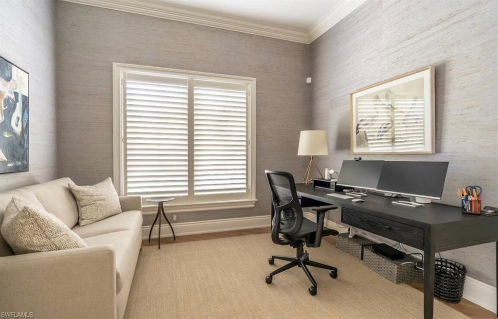 Office featuring ornamental molding and light wood-style floors