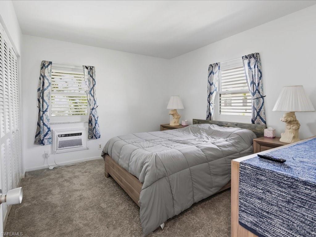 Bedroom featuring neutral carpeting and white painted walls