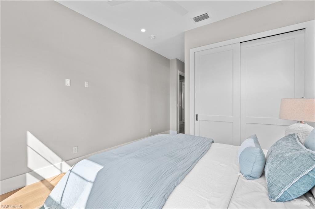 Bedroom featuring recessed lighting, a closet and ceiling fan. virtually edited photo