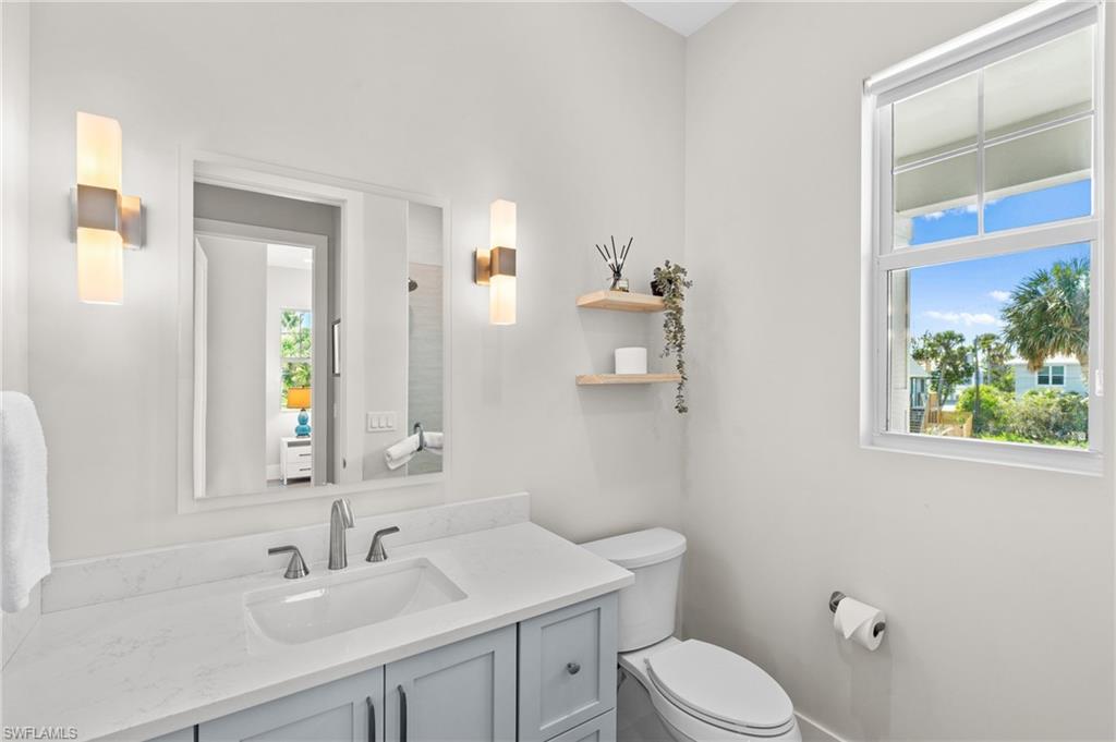 Bathroom with toilet and vanity, virtually edited photo