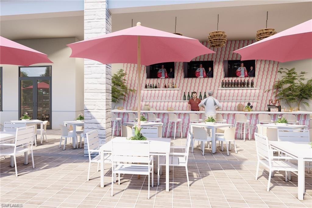Outdoor patio area featuring patterned tile flooring, a built-in bar with white countertop, and integrated shelving