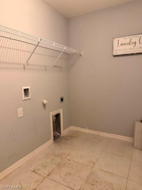 Laundry area featuring tile flooring and a built-in wire shelf
