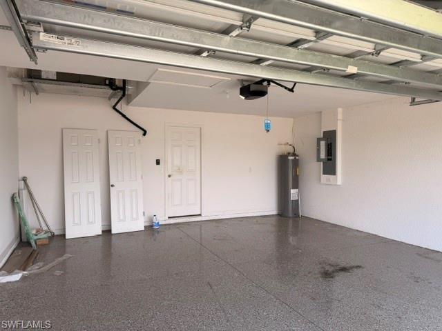 Garage interior featuring an epoxy floor, a water heater, an electrical panel, and multiple entry points