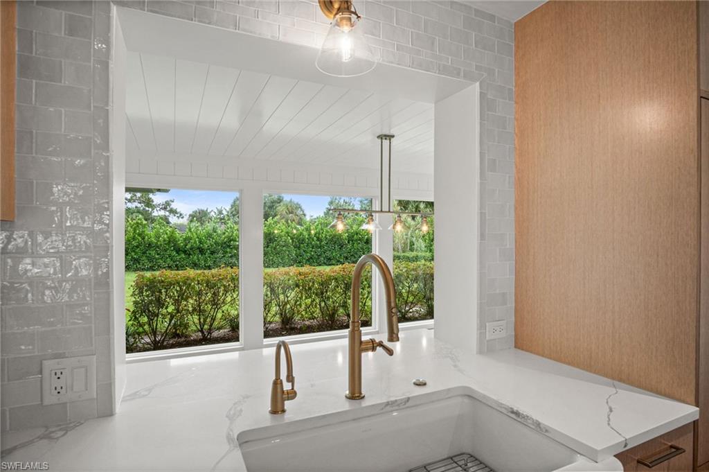 Pass through window from kitchen to dining area with stunning greenery views