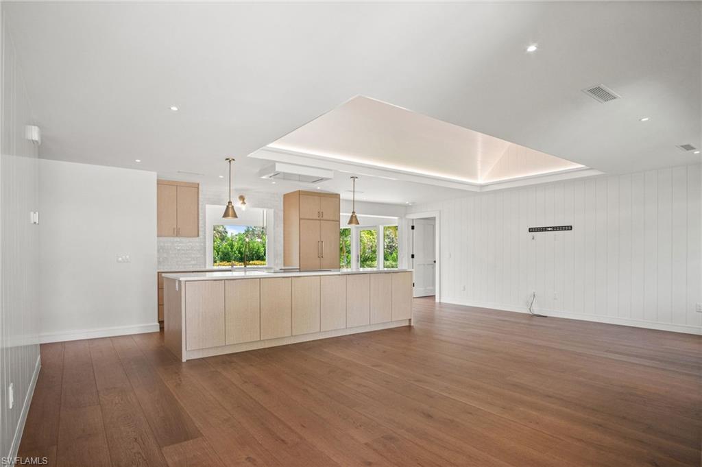Open kitchen & living space with stunning greenery views from every window.