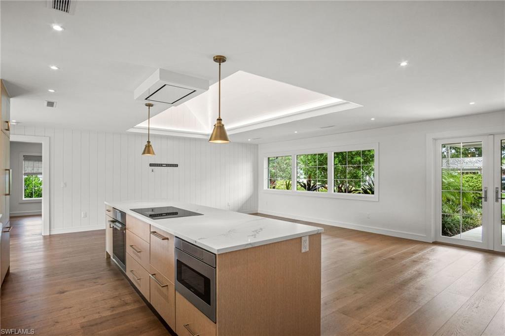 Open kitchen & living space with stunning greenery views from every window.