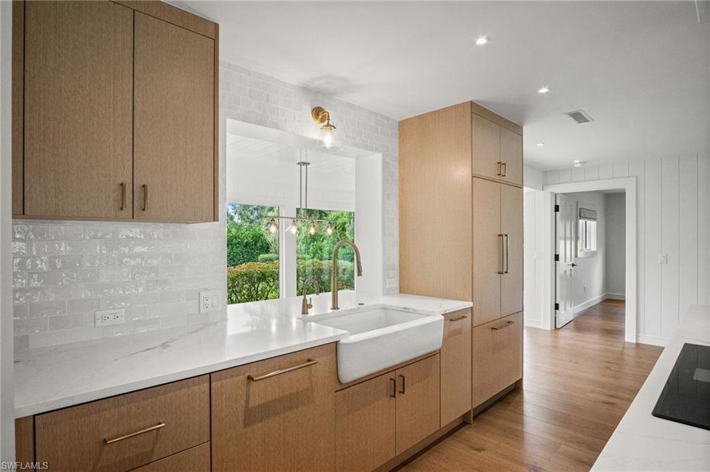 Pass through window from kitchen to dining area with stunning greenery views
