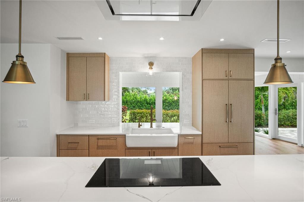 Pass through window from kitchen to dining area with stunning greenery views