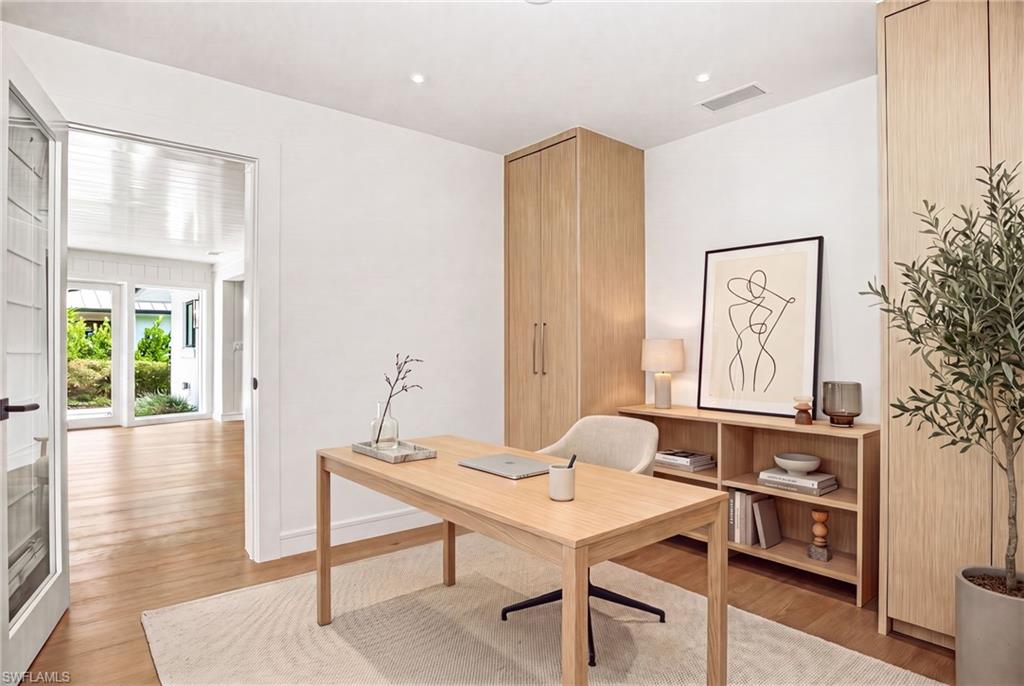 This stunning residence offers 2 BEDROOMS + DEN (EASILY USED AS A THIRD BEDROOM), 2 BATHROOMS. Photo virtually staged to show furniture possibility.
