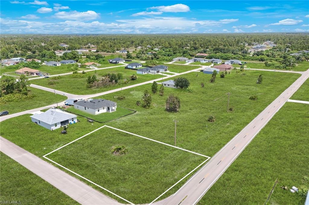 Cleared CORNER- residential lot featuring a flat terrain and direct road frontage