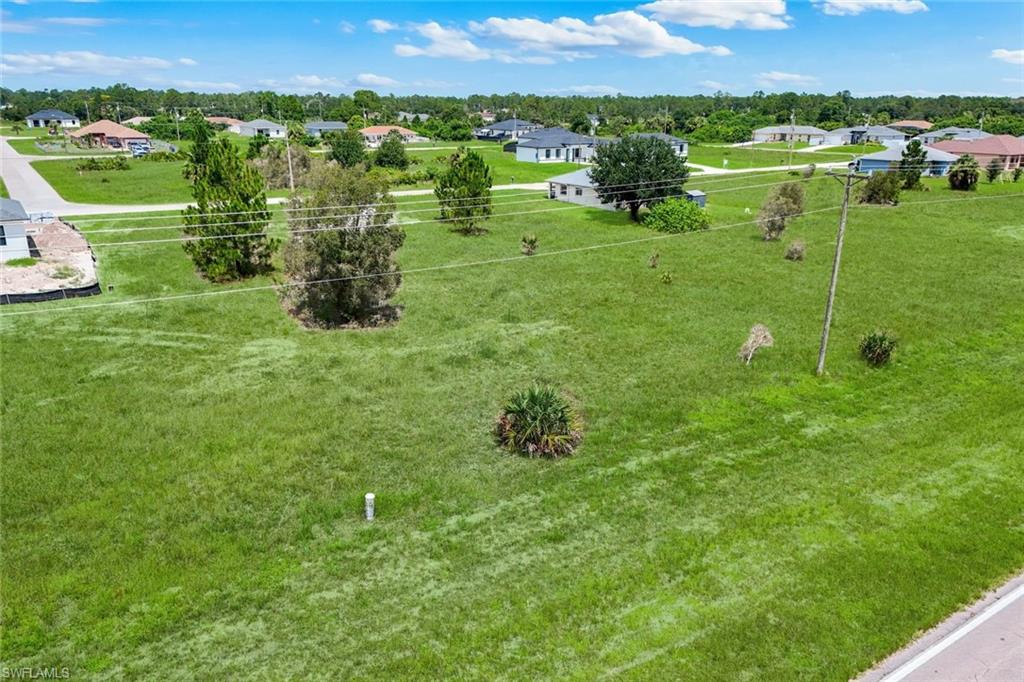 Expansive green lot featuring a street-side location