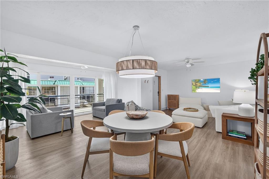 Open-concept living area with wood-finish flooring