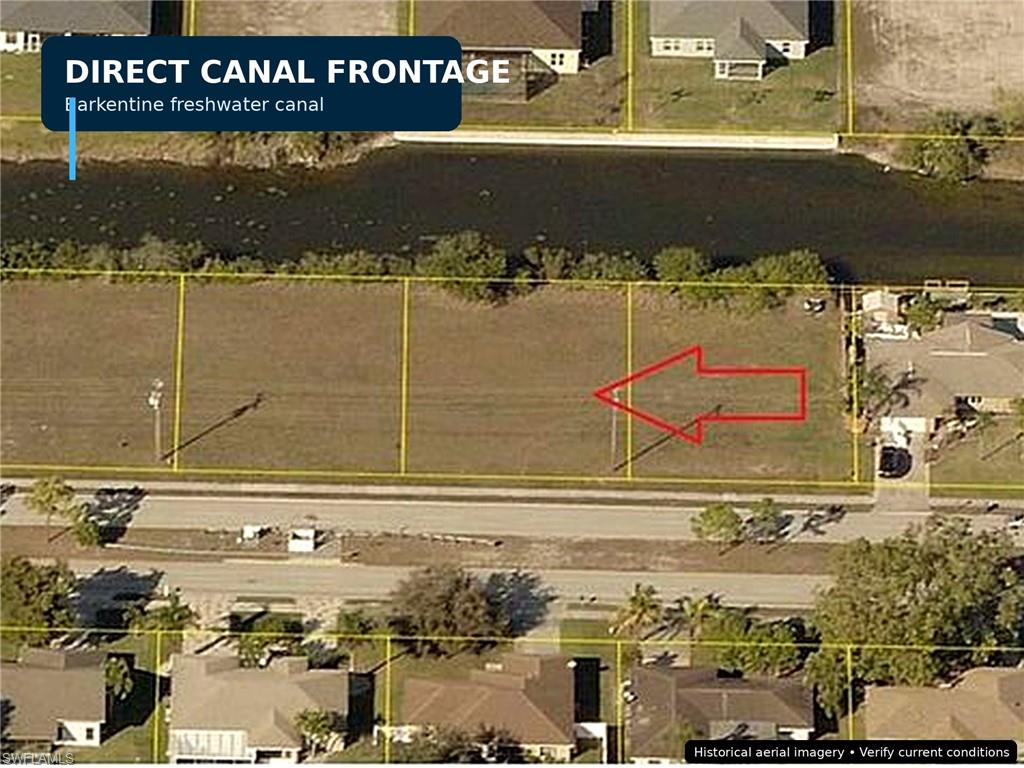 Aerial Survey. Depicting the property's boundaries and proximity to a canal, with an arrow indicating a specific parcel