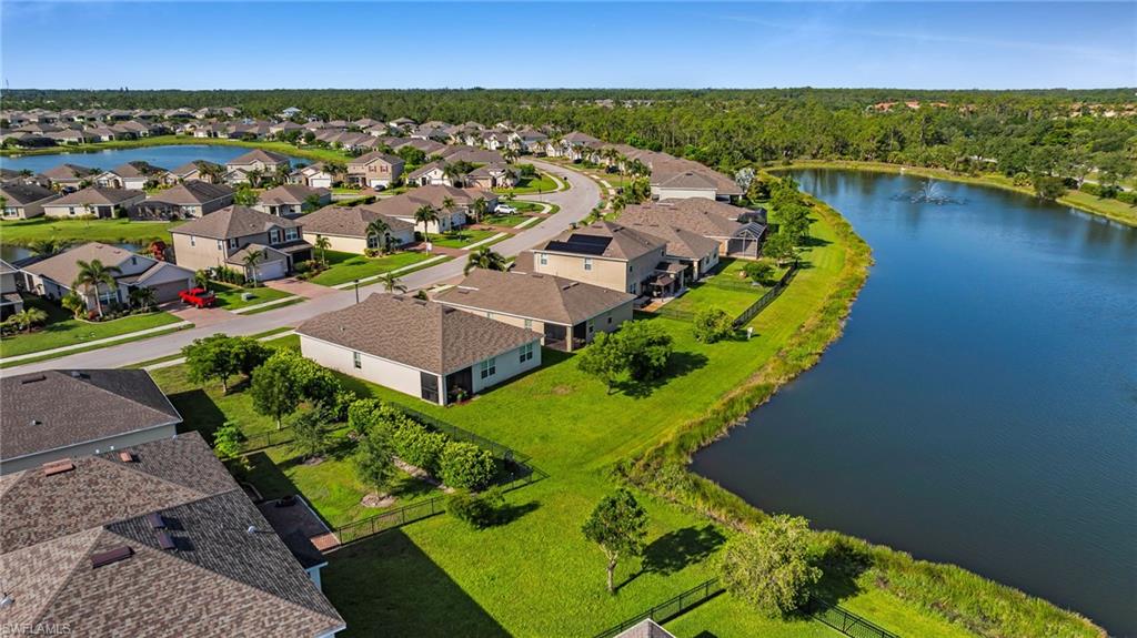 Expansive residential community featuring a large lake and numerous single-family homes