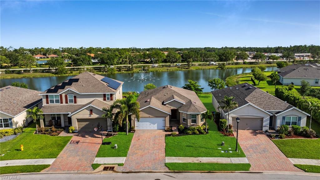 Two-story residence with a paved driveway and an attached two-car garage