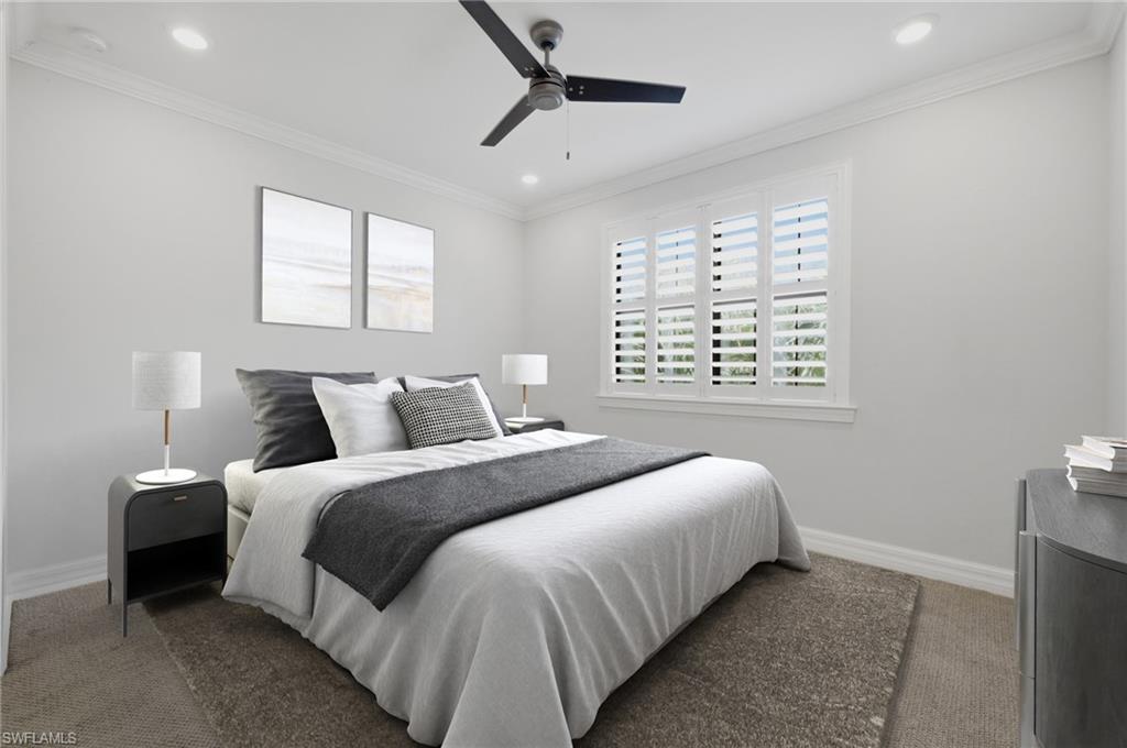 Bedroom featuring a window with white louvered shutters, crown molding, a ceiling fan, and recessed lighting