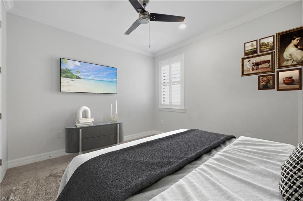 Gray wall-to-wall carpeting complements light gray wall finishes