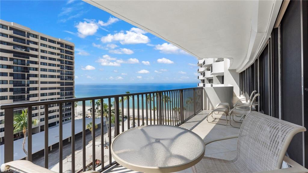 Balcony with a beach view and a water view