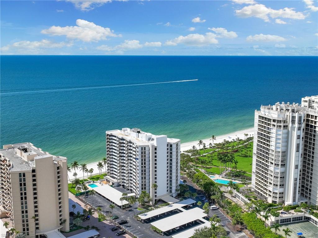 Bird's eye view featuring a water view and a view of the beach