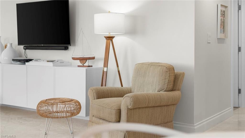 Sitting room featuring washing machine and dryer
