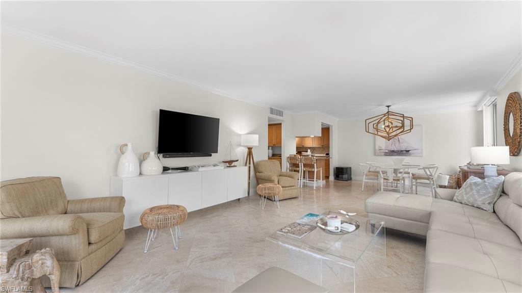 Living room featuring ornamental molding