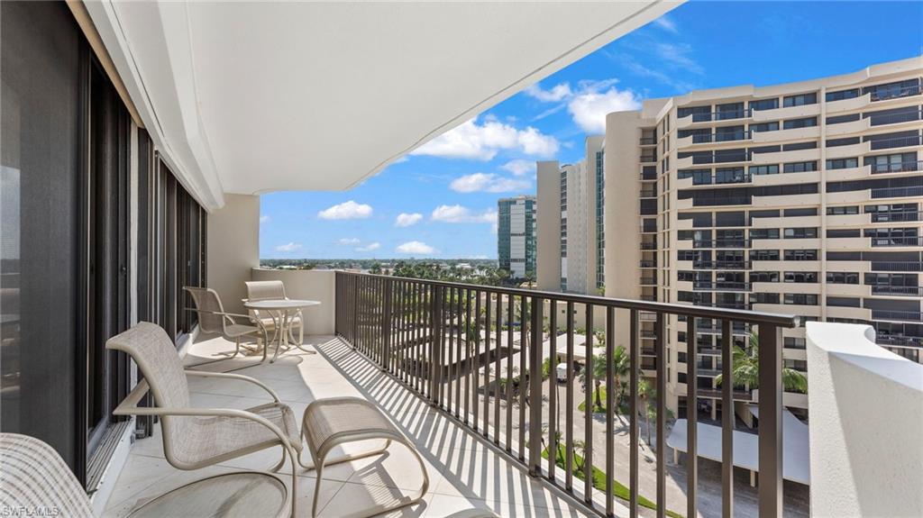 Balcony with a beach view and a water view