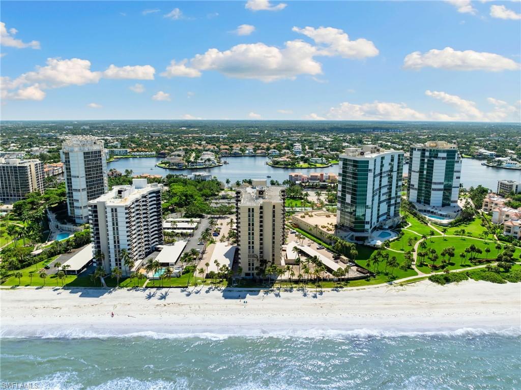 Drone / aerial view featuring a view of the beach and a water view