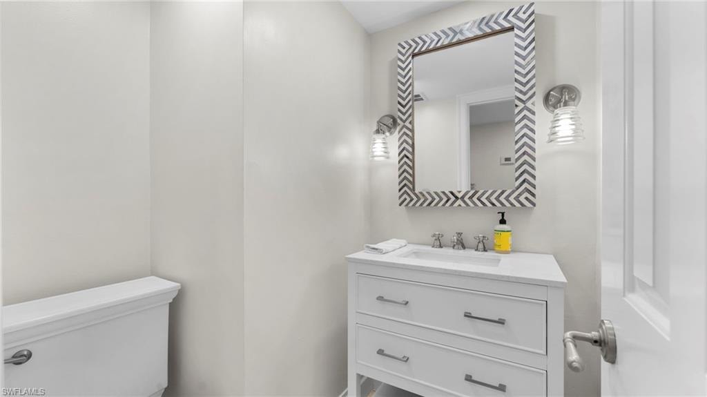 Bathroom featuring vanity and toilet