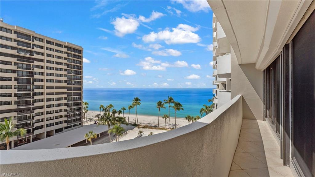 Balcony with a beach view and a water view