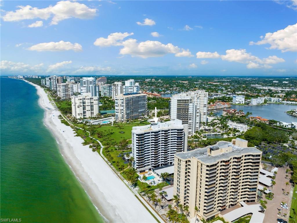 Bird's eye view with a water view and a beach view