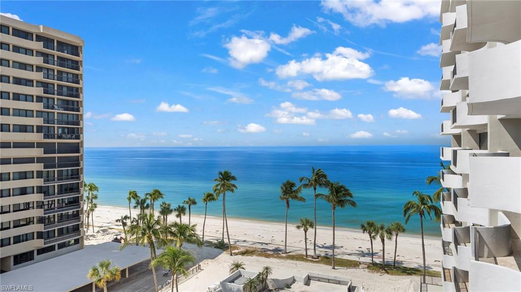 Property view of water featuring a beach view