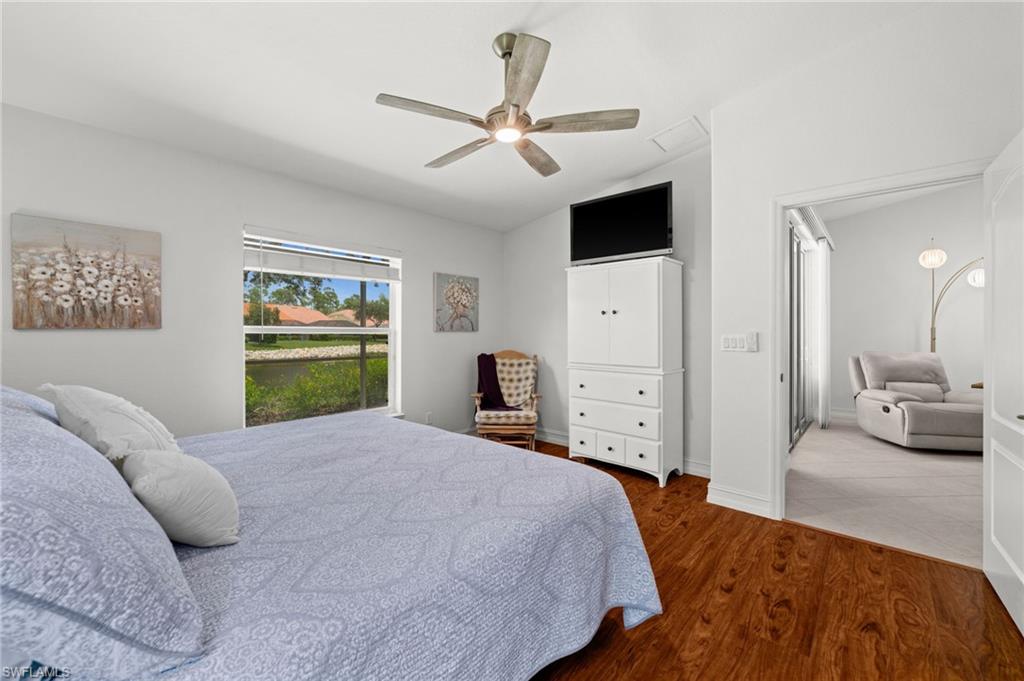 Bright interior space featuring wood-finish flooring and a window overlooking exterior landscaping