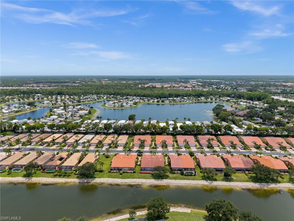 Aerial perspective showcasing a residential community with water features